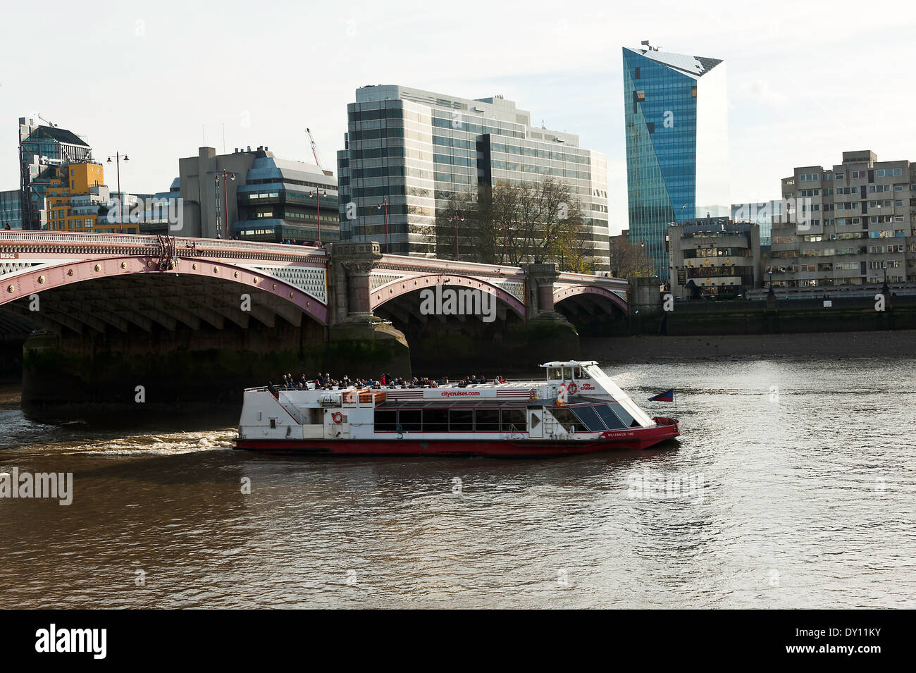 The City Cruises Passenger Boat Passes Under Blackfriars Bridge on River Thames London England United Kingdom UK Stock Photo