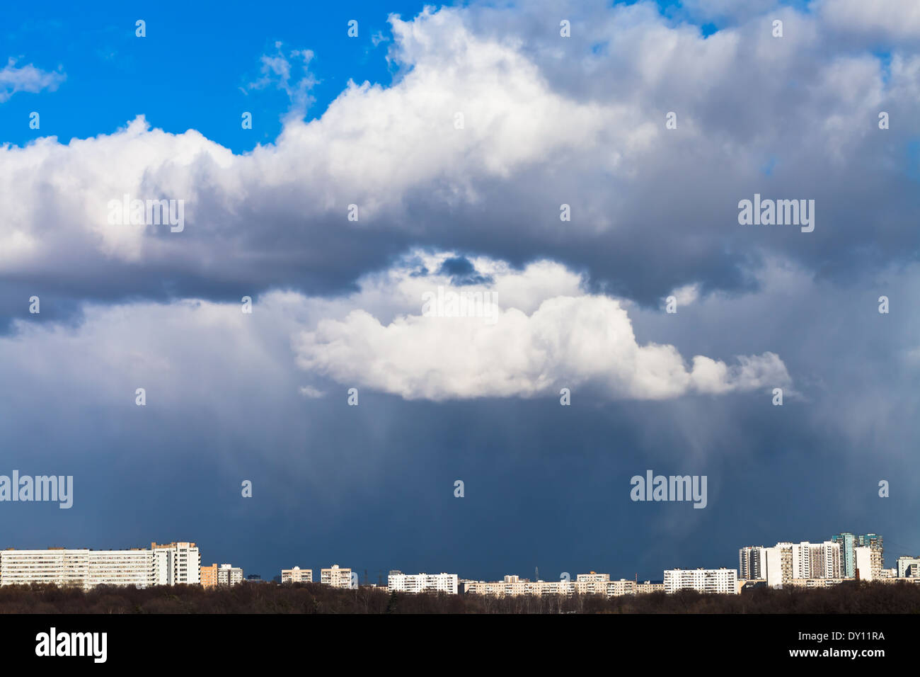 rainy clouds over city in spring day Stock Photo - Alamy
