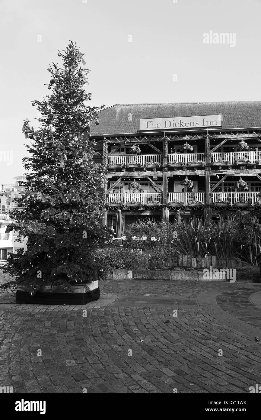 The Christmas Tree with The Dickens Inn Public House in St Katharine Docks Tower Hamlets London England United Kingdom UK Stock Photo