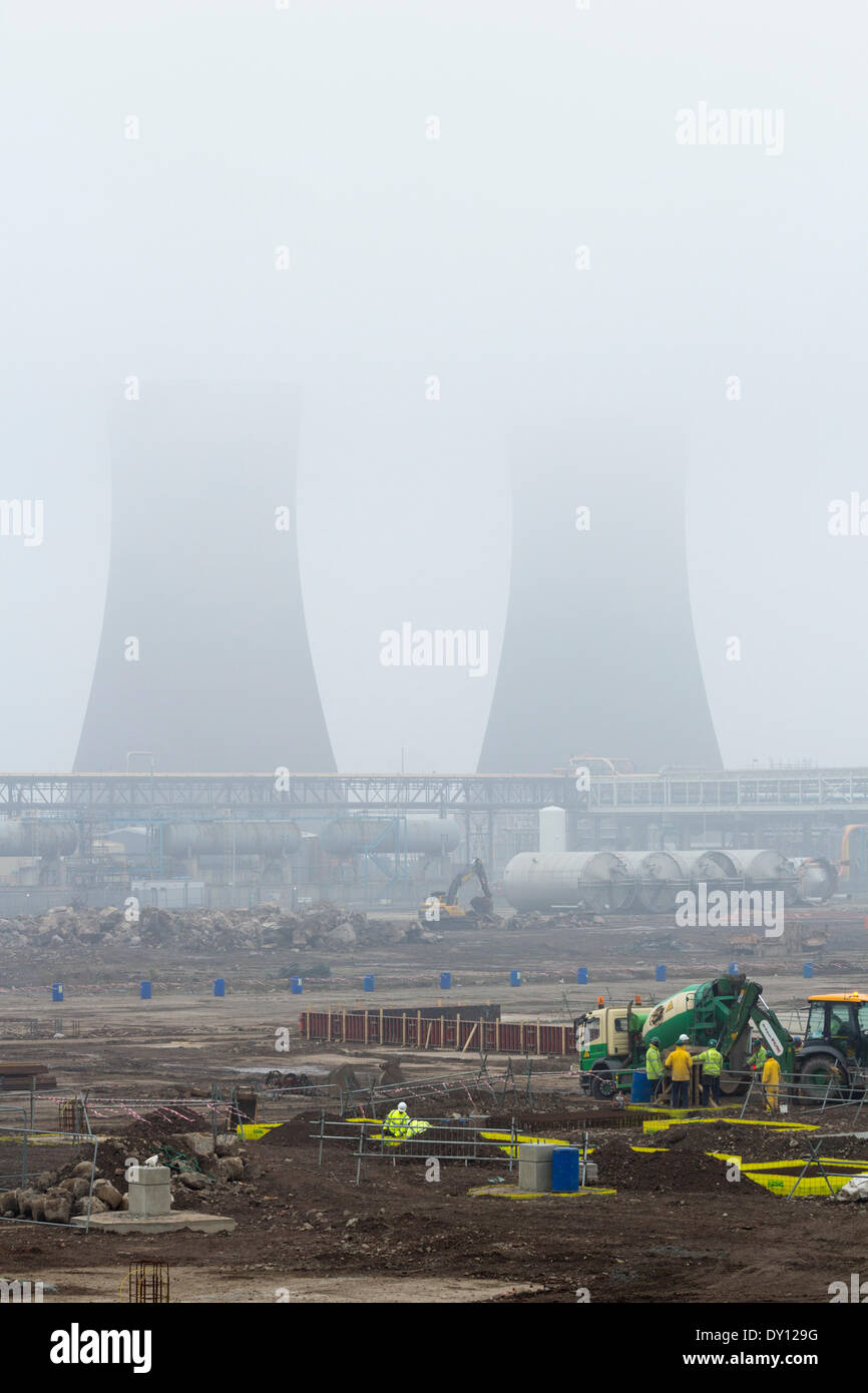 Billingham, England, UK. 2nd April 2014. Cooling towers barely visible through haze and low cloud on chemical plant construction site in Billingham, north east England. Pollution level are on the rise the next couple of days. The poor air quality is creating a haze over much of England. Credit:  ALANDAWSONPHOTOGRAPHY/Alamy Live News Stock Photo