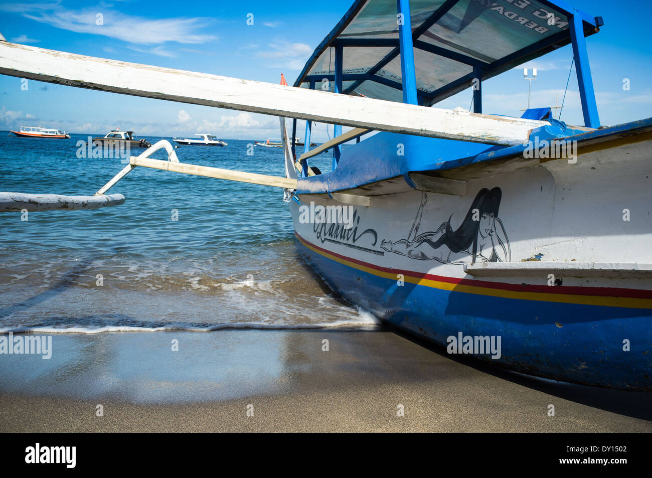 traditional style tourist boat in the shallow waters of Gili Trawangan Lombok Indonesia, Asia Stock Photo