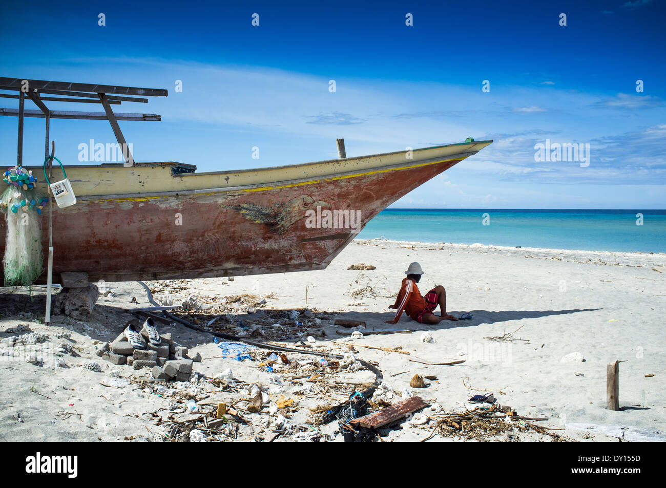 Man resting in the shade on the beach Gili Trawangan, Lombok, Indonesia Stock Photo