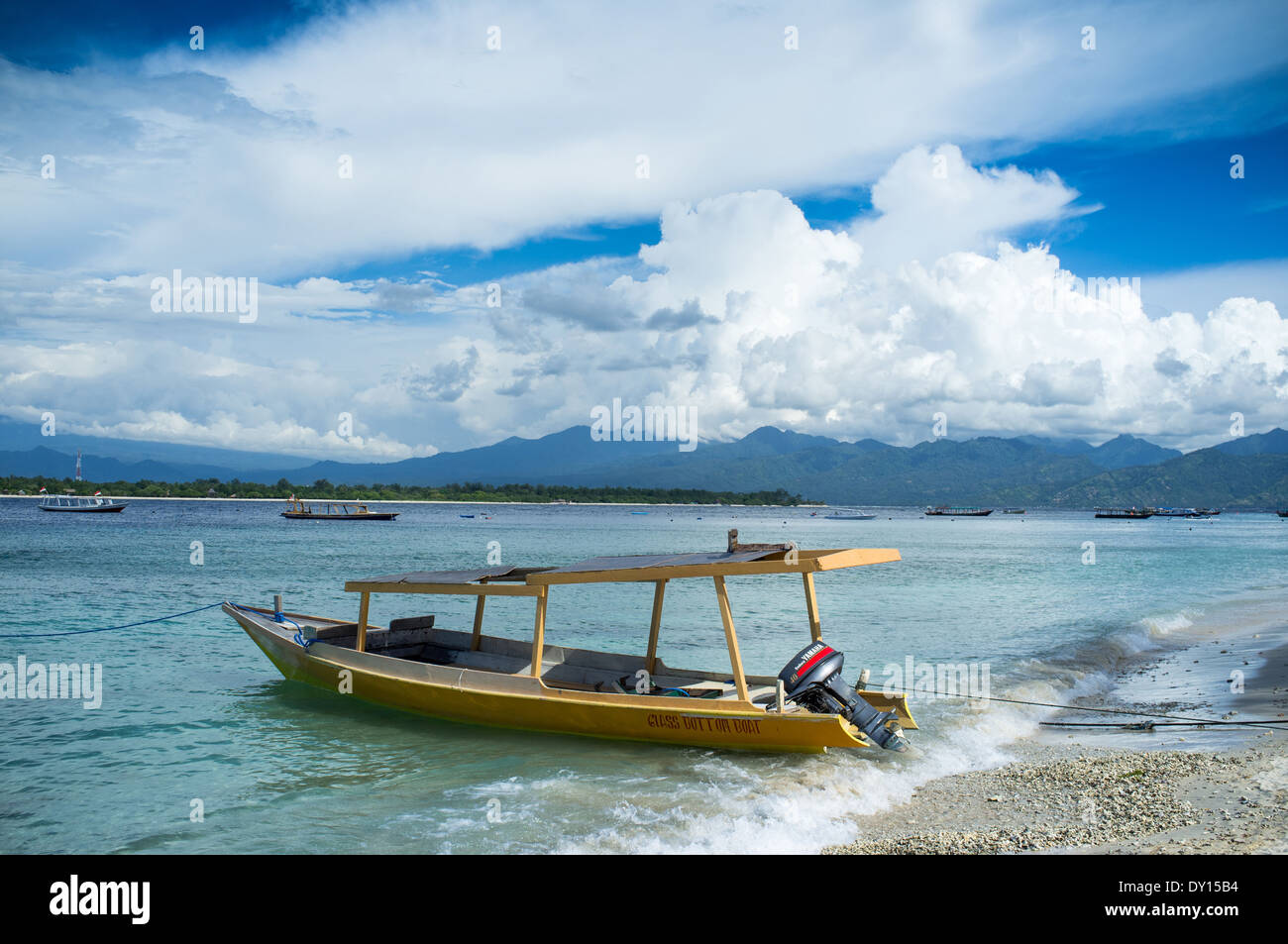 traditional style tourist boat in the shallow waters of gili trawangan lombok indonesia Stock Photo