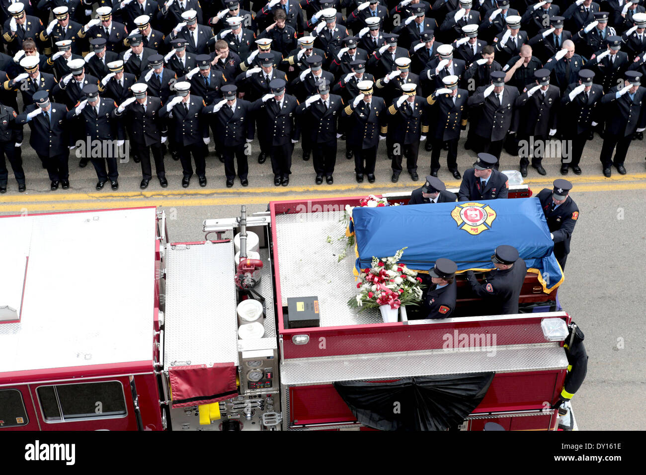 Watertown, Massachusetts, USA. 2nd Apr, 2014. Thousands of firefighters from across the nation gathered outside the Church of Saint Patrick in Watertown, Massachusetts to attend the funeral of fallen Boston Firefighter Lieutenant Edward Walsh. Walsh and fellow firefighter Michael Kennedy died in a nine-alarm blaze at 298 Beacon Street in Boston, Massachusetts. Credit:  Nicolaus Czarnecki/METRO Boston/ZUMAPRESS.com/Alamy Live News Stock Photo