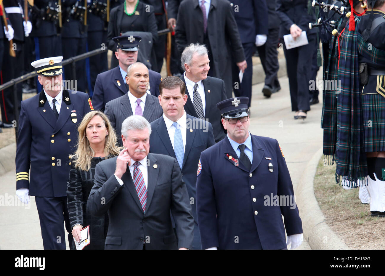 Watertown, Massachusetts, USA. 2nd Apr, 2014. Thousands of firefighters from across the nation gathered outside the Church of Saint Patrick in Watertown, Massachusetts to attend the funeral of fallen Boston Firefighter Lieutenant Edward Walsh. Walsh and fellow firefighter Michael Kennedy died in a nine-alarm blaze at 298 Beacon Street in Boston, Massachusetts. Boston Mayor Marty Walsh, center, and his girlfriend, Lorrie Higgins by his side, attend the service along with Massachusetts Govenor Deval Patrick, rear center. Credit:  Nicolaus Czarnecki/METRO Boston/ZUMAPRESS.com/Alamy Live News Stock Photo