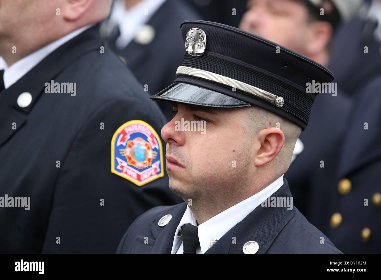 Watertown, Massachusetts, USA. 2nd Apr, 2014. Thousands of firefighters from across the nation gathered outside the Church of Saint Patrick in Watertown, Massachusetts to attend the funeral of fallen Boston Firefighter Lieutenant Edward Walsh. Walsh and fellow firefighter Michael Kennedy died in a nine -alarm blaze at 298 Beacon Street in Boston, Massachusetts. Credit:  Nicolaus Czarnecki/METRO Boston/ZUMAPRESS.com/Alamy Live News Stock Photo