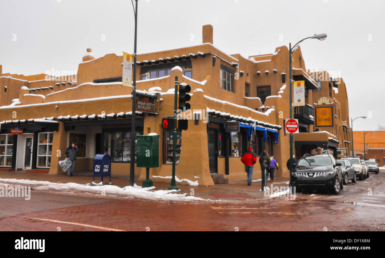 Remnants of snow linger on the La Fonda Hotel on a winter's day on the plaza in downtown Santa Fe, NM Stock Photo