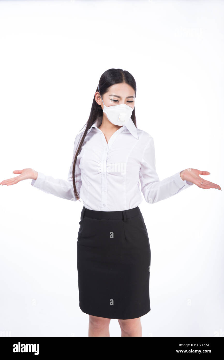 black hair girl with a mask on her face. Isolated on white Stock Photo