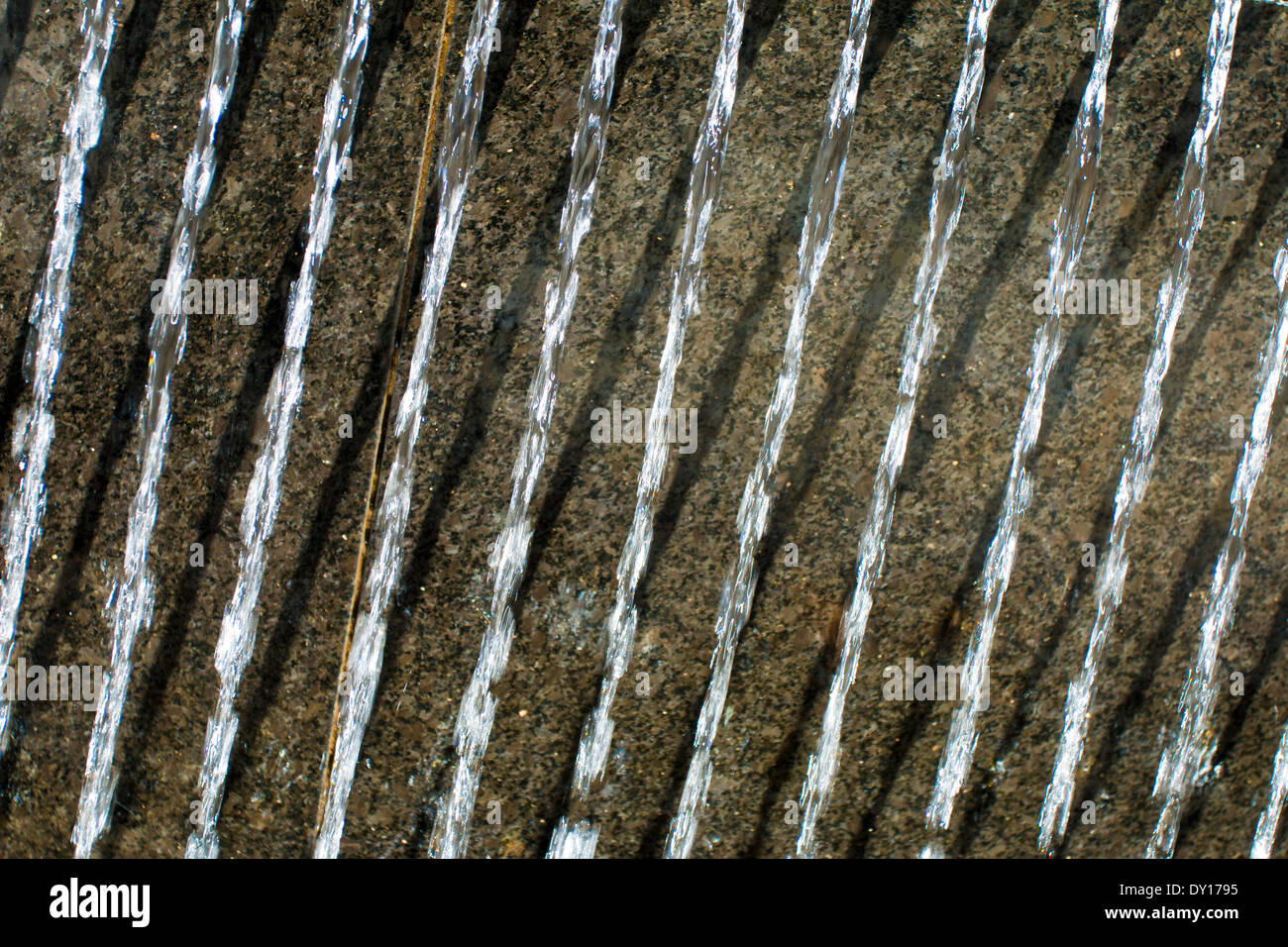 Streams of running water from fountain Stock Photo