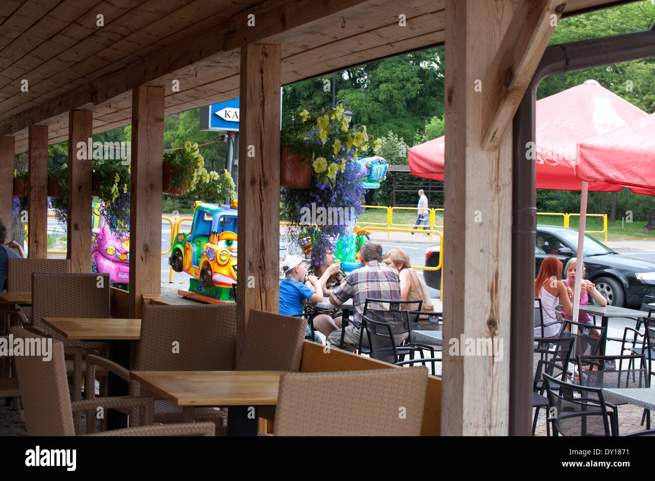 People enjoying ice cream cones in an outdoor restaurant. Spala Central Poland Stock Photo