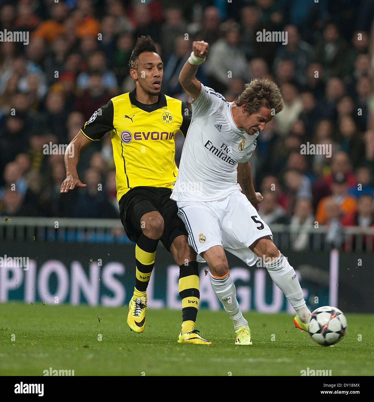 Madrid, Spain. 2nd Apr, 2014. Real Madrid's Fabio Coentrao (R) shoots during the UEFA Champions League quarter-final first leg match against Dortmund at Santiago Bernabeu stadium in Madrid, Spain, April 2, 2014. Real Madrid won the match by 3-0. Credit:  Xie Haining/Xinhua/Alamy Live News Stock Photo