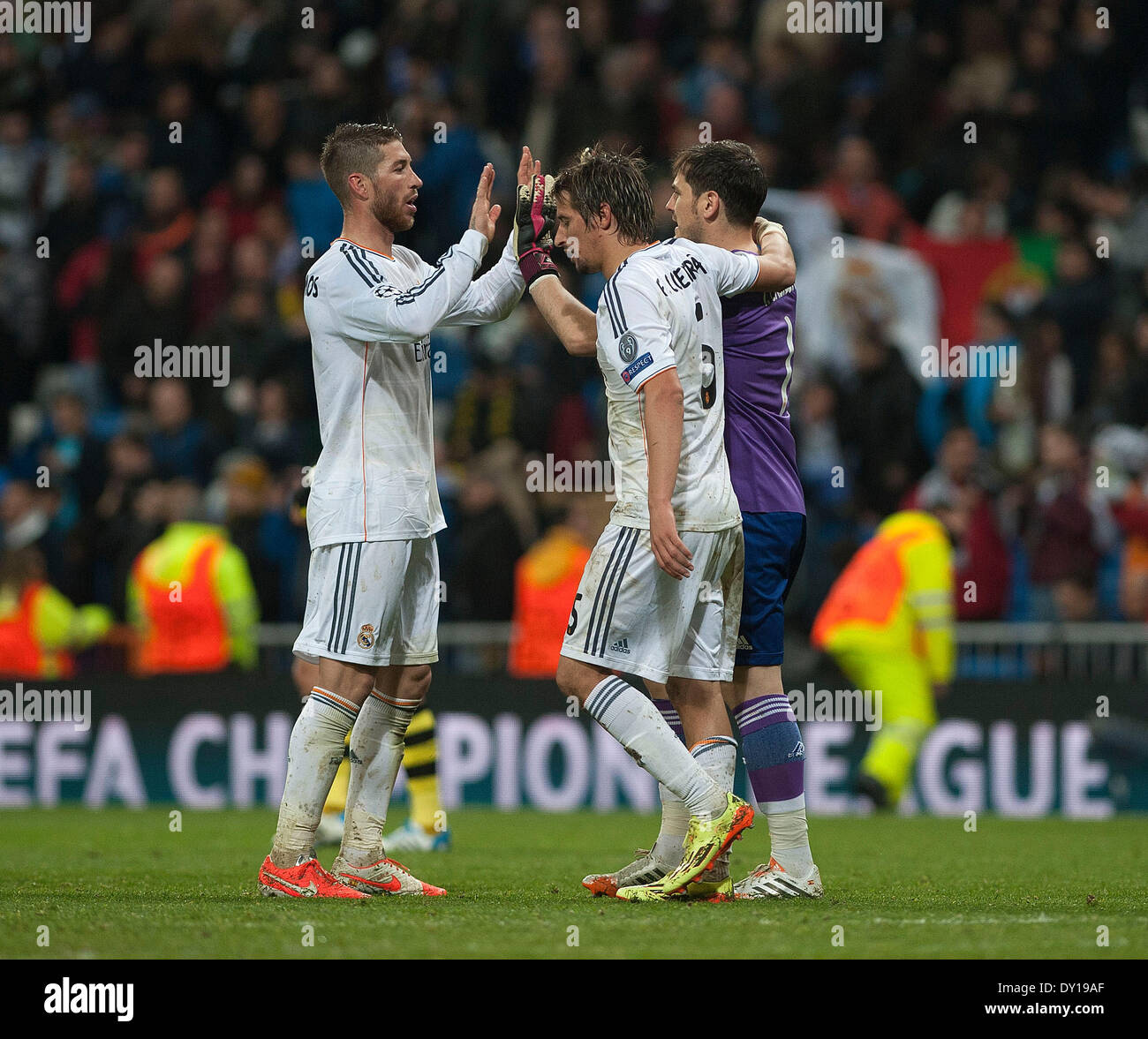 Madrid, Spain. 2nd Apr, 2014. (From R to L)Real Madrid's Iker Casillas, Fabio Coentrao and Sergio Ramos celebrate victory over Dortmund after the UEFA Champions League quarter-final first leg match at Santiago Bernabeu stadium in Madrid, Spain, April 2, 2014. Real Madrid won the match by 3-0. Credit:  Xie Haining/Xinhua/Alamy Live News Stock Photo
