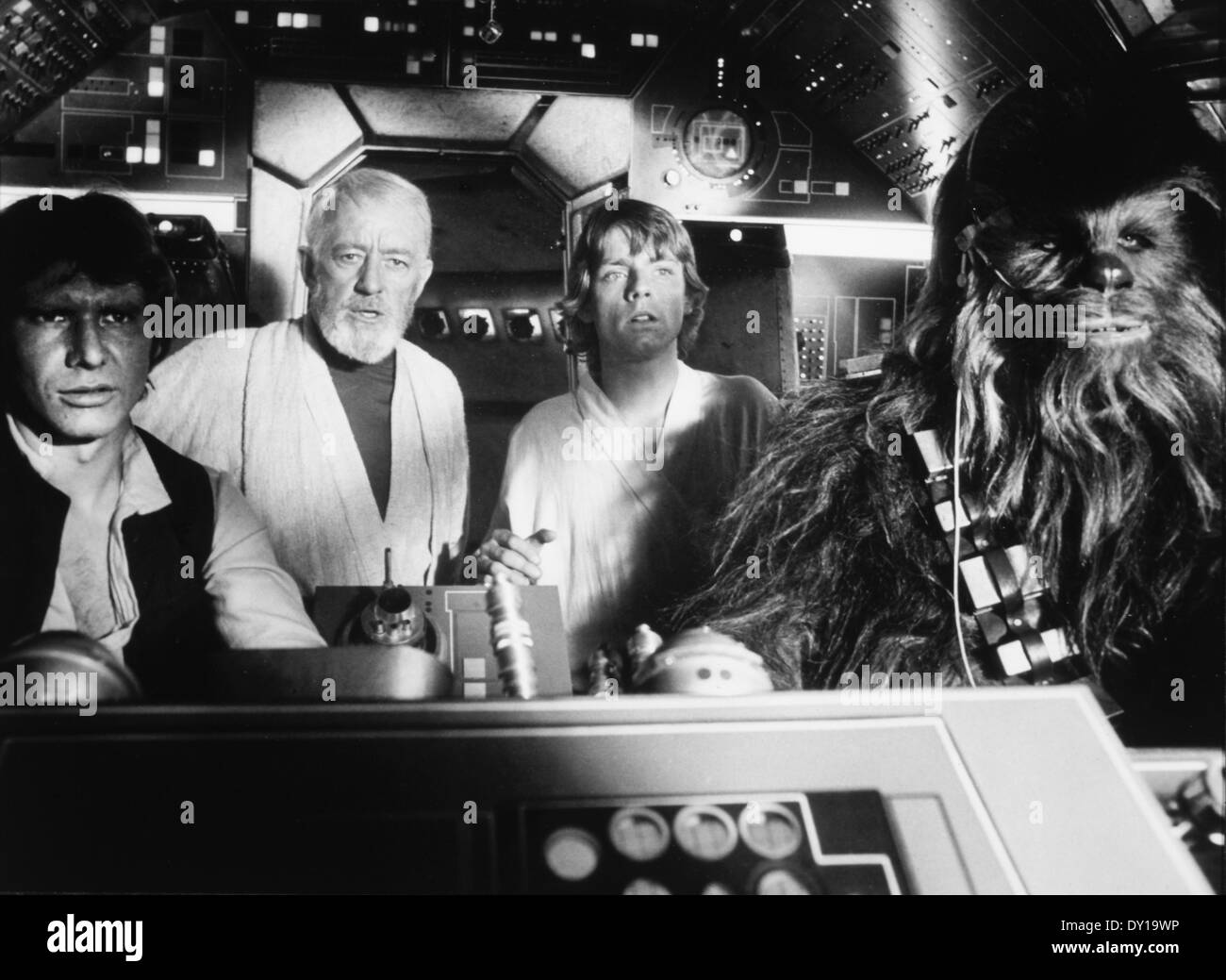 Peter Mayhew, Harrison Ford, Alec Guinness and Mark Hamill, on-set of the Film, "Star Wars", 1977 Stock Photo