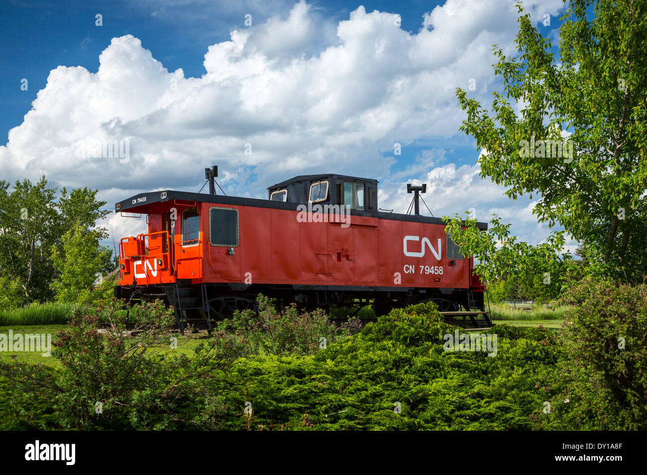 The red CN caboose is a part of history located in a small park in Vegreville, Alberta, Canada. Stock Photo