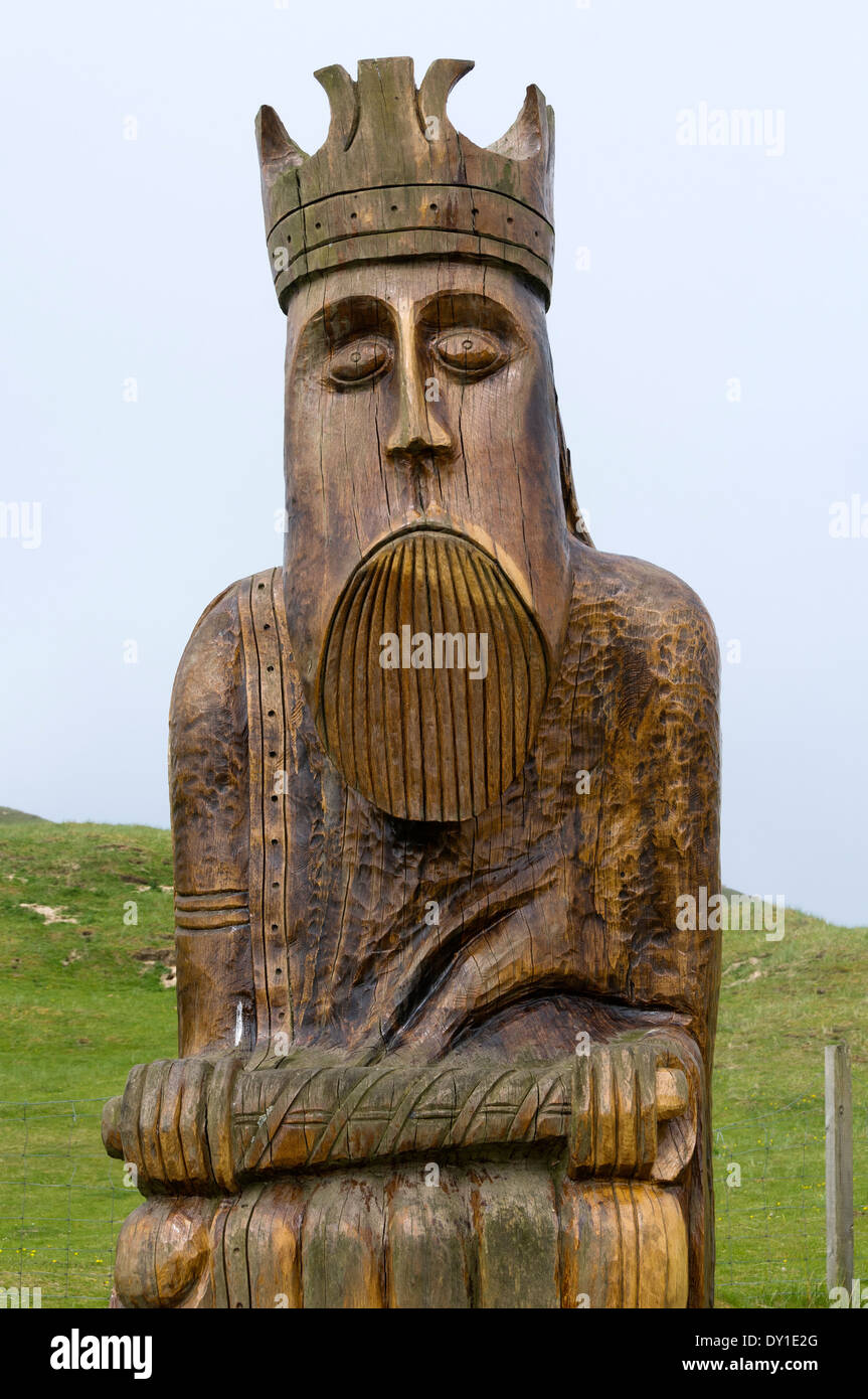 Carved wooden replica of one of the Lewis Chessmen which were found near here, near Uig, Lewis, Western Isles, Scotland, UK Stock Photo