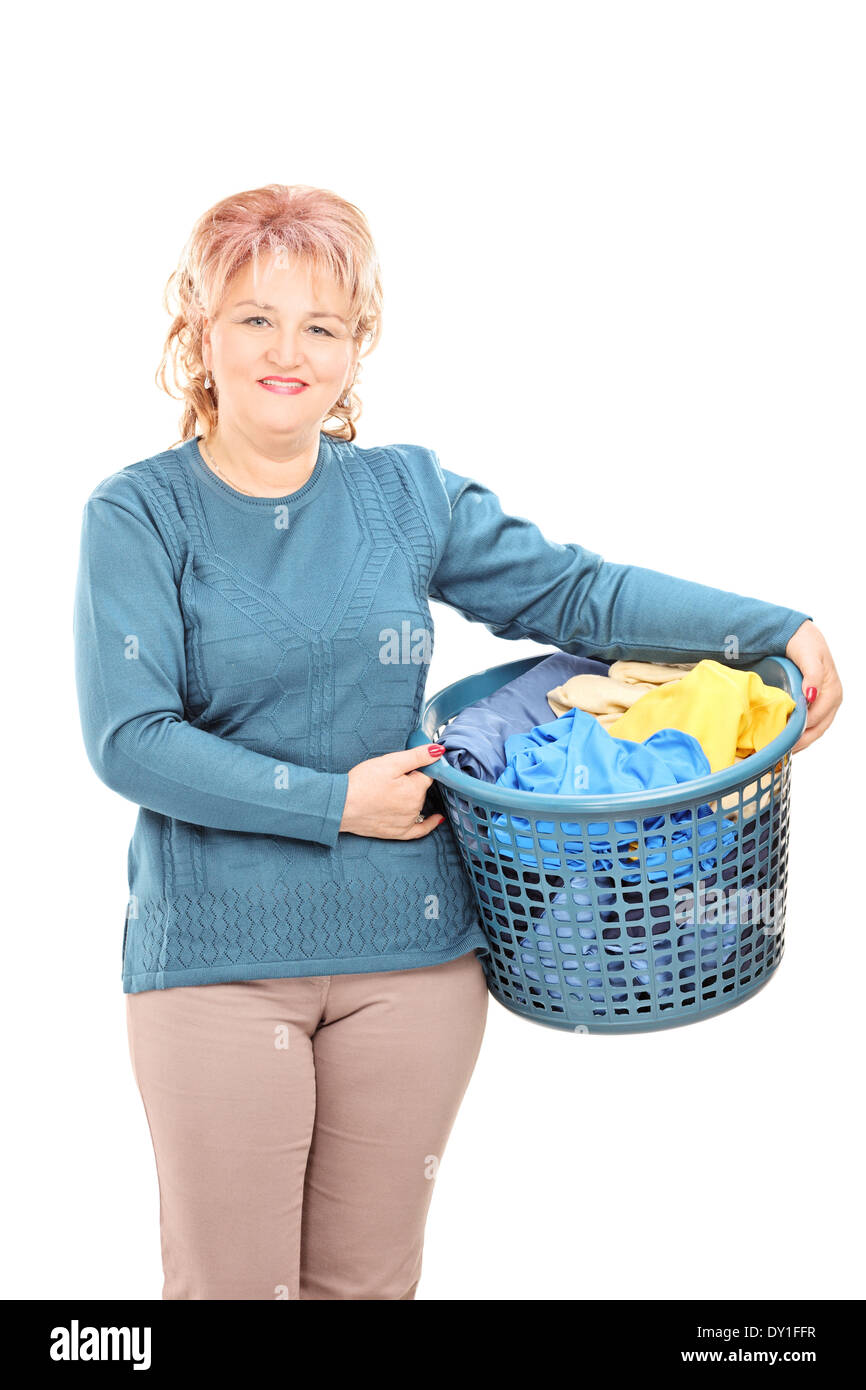 Mature woman holding a laundry basket Stock Photo