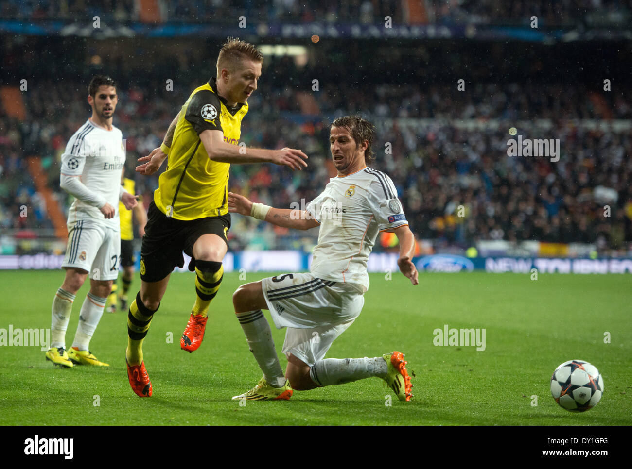 Madrid, Spain. 02nd Apr, 2014. Marco Reus (L) of Dortmund and Real Madrid's Fabio Coentrao vie for the ball during the UEFA Champions League quarter final first leg soccer match between Real Madrid and Borussia Dortmund at Santiago Bernabeu stadium in Madrid, Spain, 02 April 2014. Photo: Bernd Thissen/dpa/Alamy Live News Stock Photo