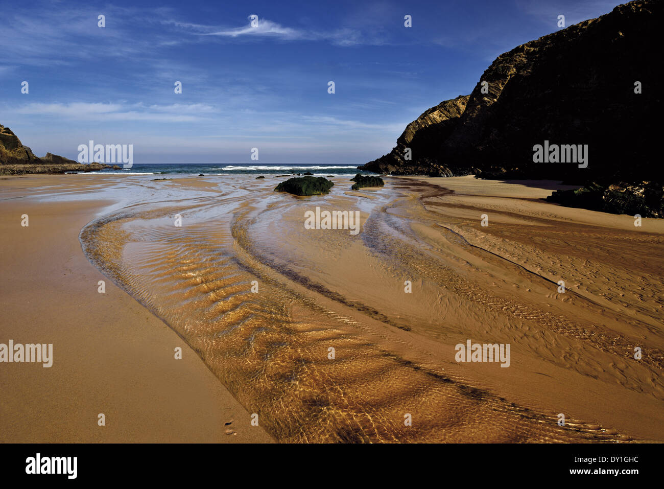 Portugal, Alentejo, Nature Park Costa Vicentina and Soouthwest Alentejo, beach, Praia do Carvalhal, low tide, wet sand, water running to the ocean, cliffs, travel, tourism, nature, calm, relaxing, peaceful, coast, coastal, seascape, seaside, ocean, Atlanti Stock Photo