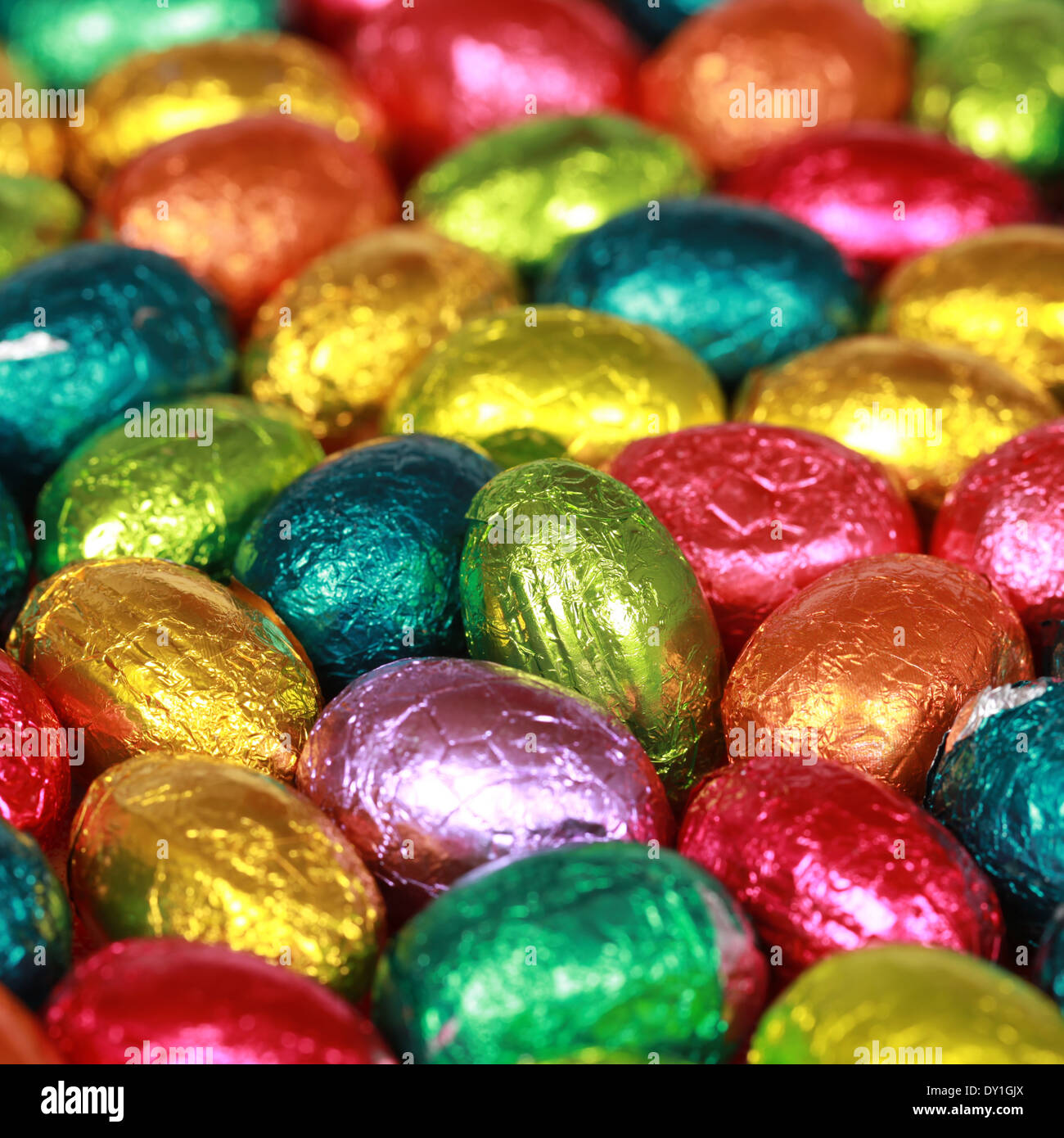 Group of colorful chocolate eggs forming a background Stock Photo