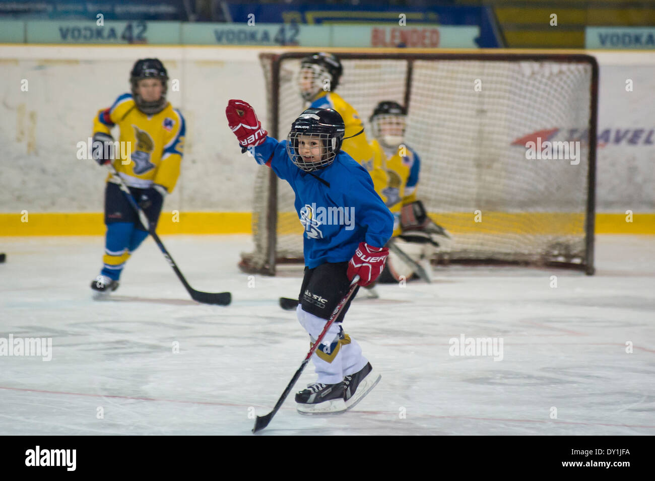 baby-boy ice hockey player celebrates goal Stock Photo