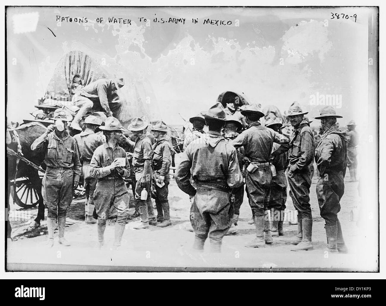 This image captures the provision of water rations to U.S. Army ...