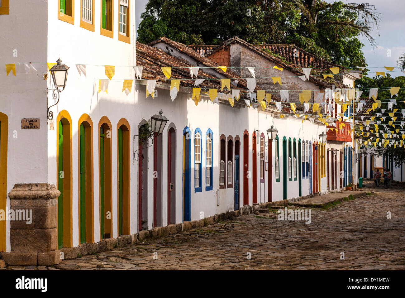 Paraty, colonial town, typical colonial houses in a cobblestone paved street, flags, Rio de Janeiro, Costa Verde, Brazil Stock Photo