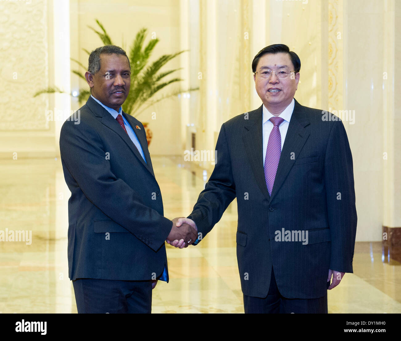 Beijing, China. 3rd Apr, 2014. Zhang Dejiang (R), chairman of China's National People's Congress Standing Committee, shakes hands with Fatih Ezzedine al-Mansur, speaker of the National Assembly of the Republic of the Sudan, during their talks in Beijing, capital of China, April 3, 2014. © Wang Ye/Xinhua/Alamy Live News Stock Photo