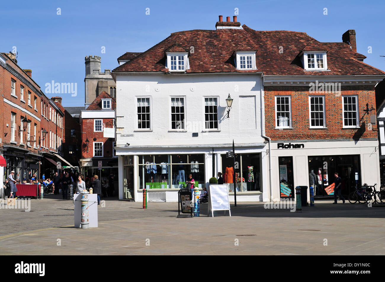 Shops and buildings in The Square, Winchester, Hampshire on a sunny spring morning Stock Photo