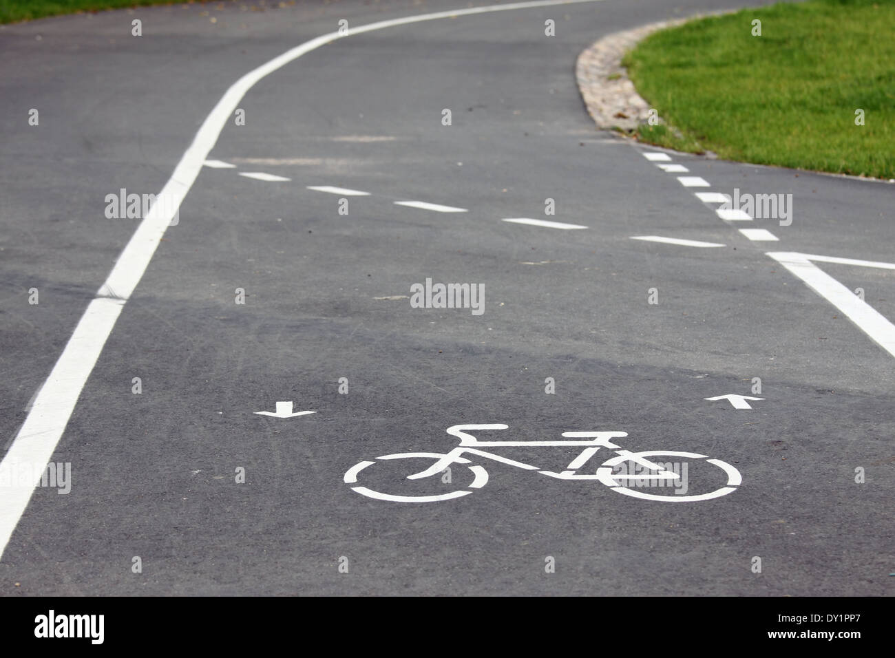 Bicycle route sign on the road and arrows pointing direction Stock Photo