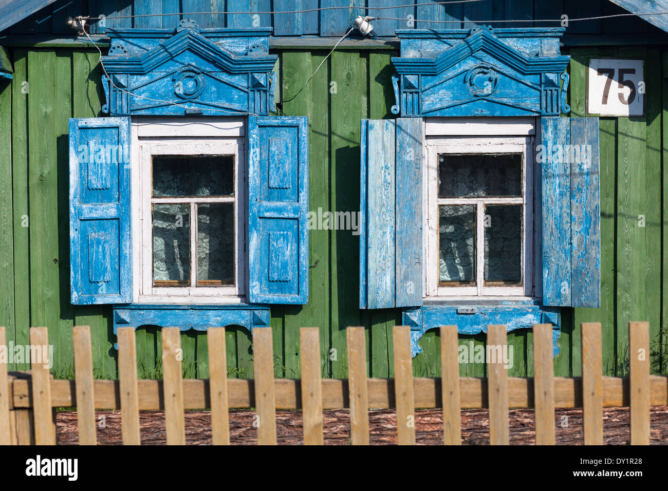 Windows with traditional wooden shutters in Bolshoe Goloustnoe on the shore of Lake Baikal, Siberia, Russia Stock Photo