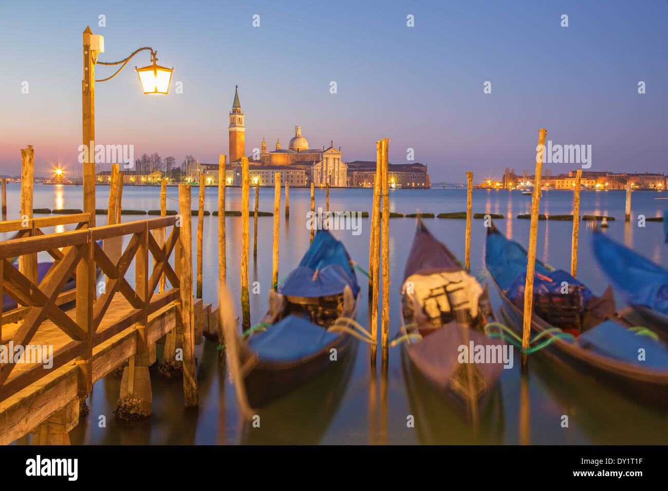 Venice - Gondolas and San Giorgio Maggiore church in background in morning dusk. Stock Photo