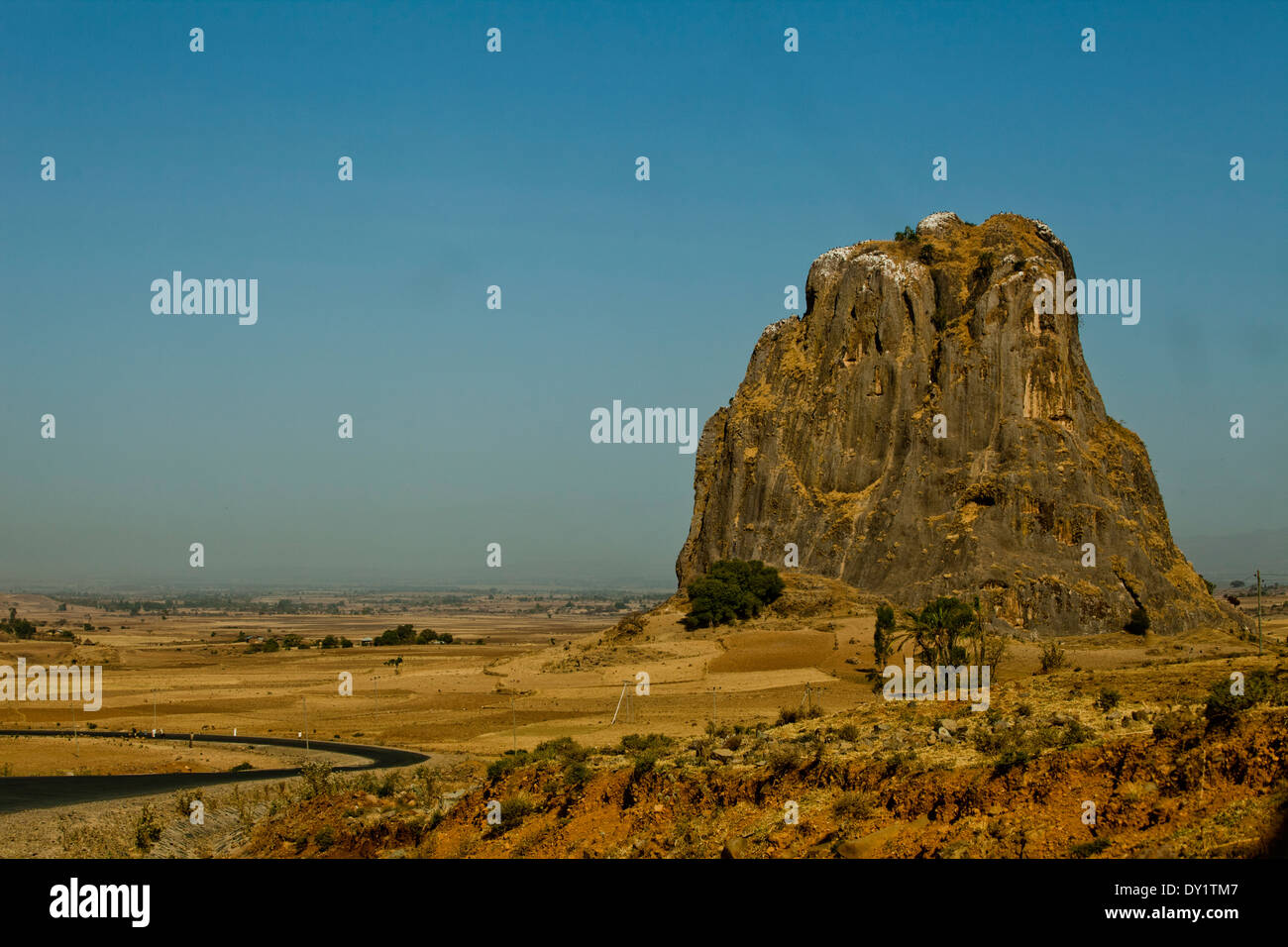 Large Rock Monolith with Road Ethiopia Africa vista Stock Photo
