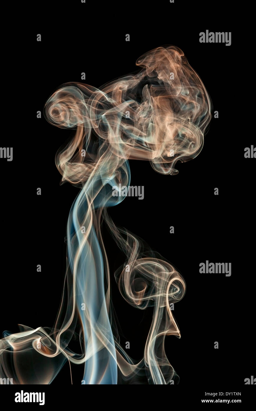 abstract colored smoke isolated on a black background Stock Photo - Alamy