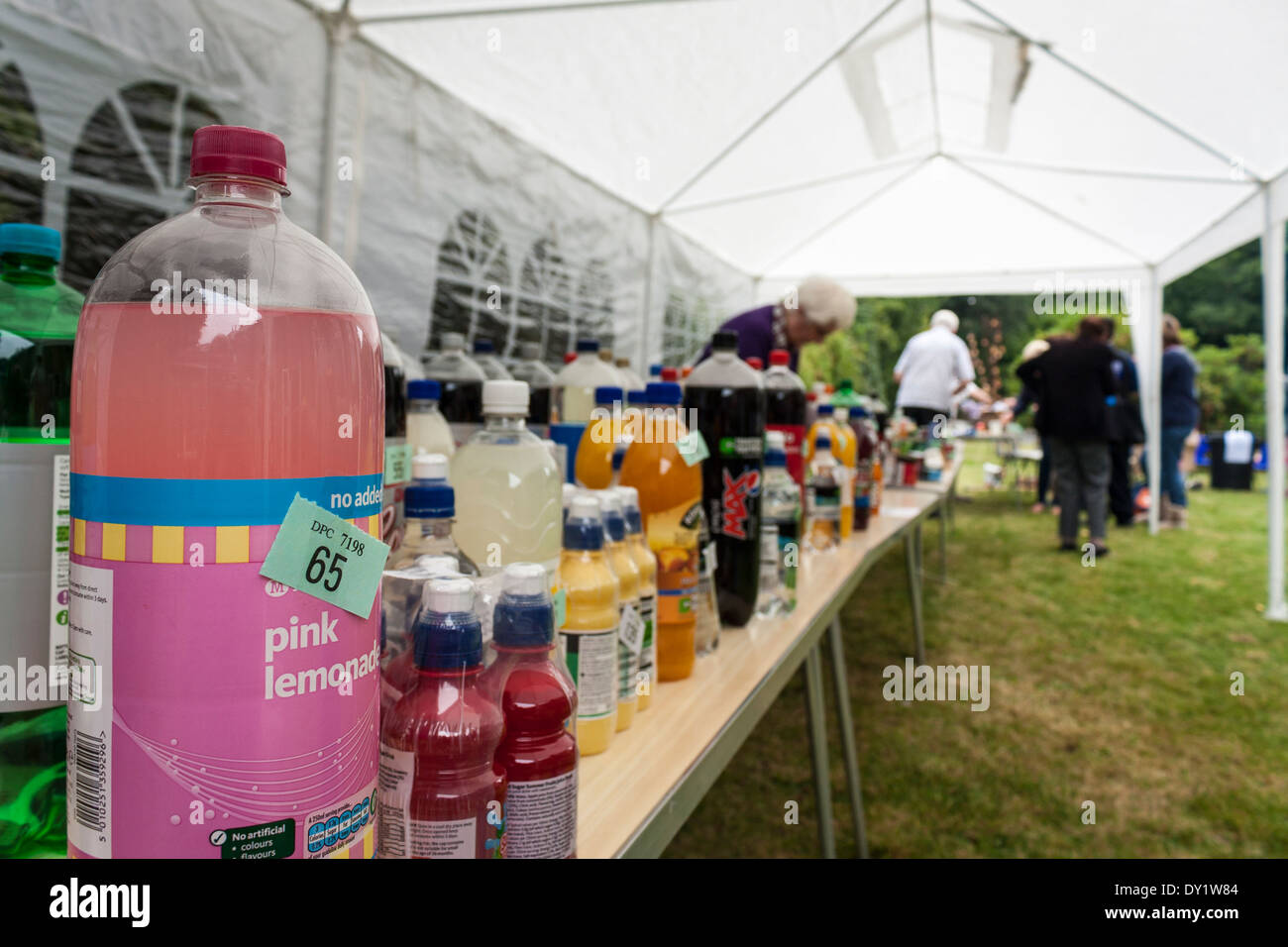Tombola stall at an English church summer fete. Soft drinks as prizes. Stock Photo