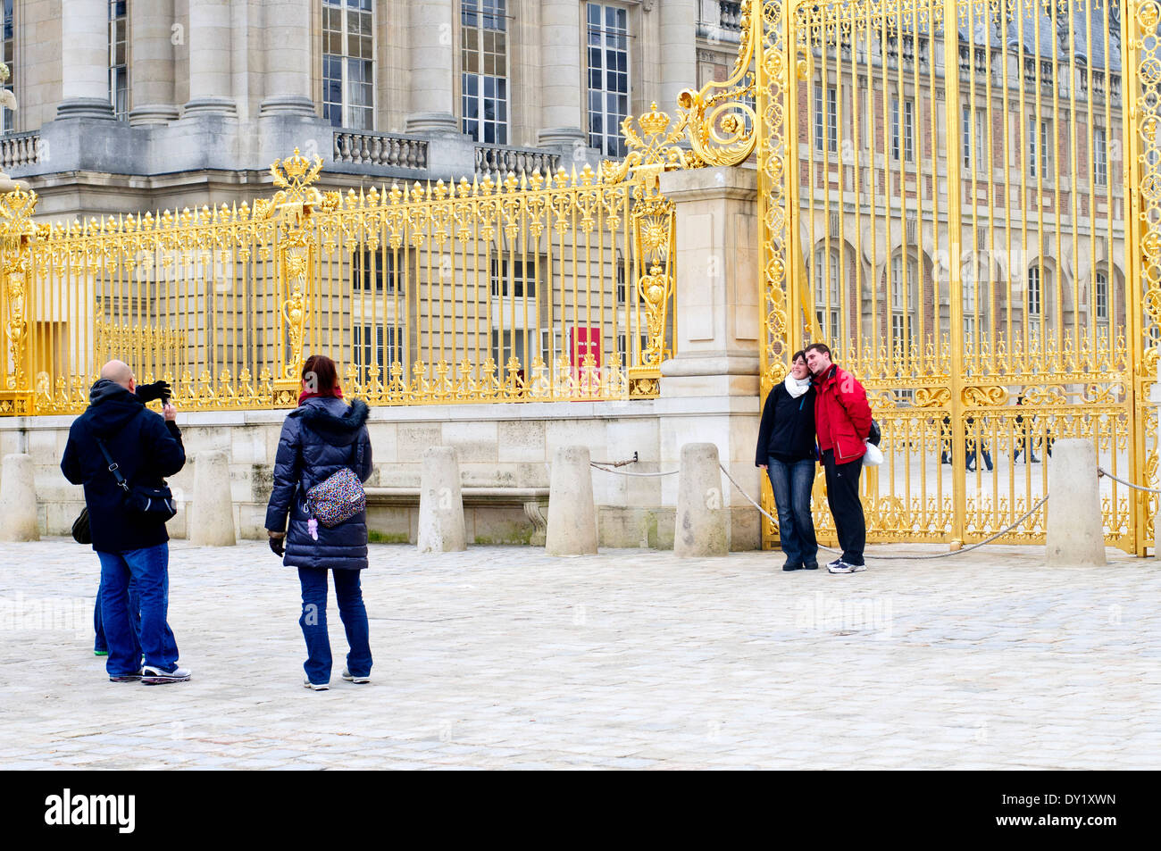 Tourists Taking Pictures at the Palace of Versailles Entrance, Paris Stock Photo