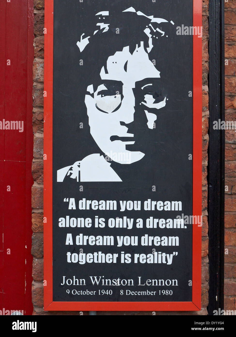 John Lennon 'words of wisdom' poster on outside wall in Mathew Street Liverpool UK Stock Photo