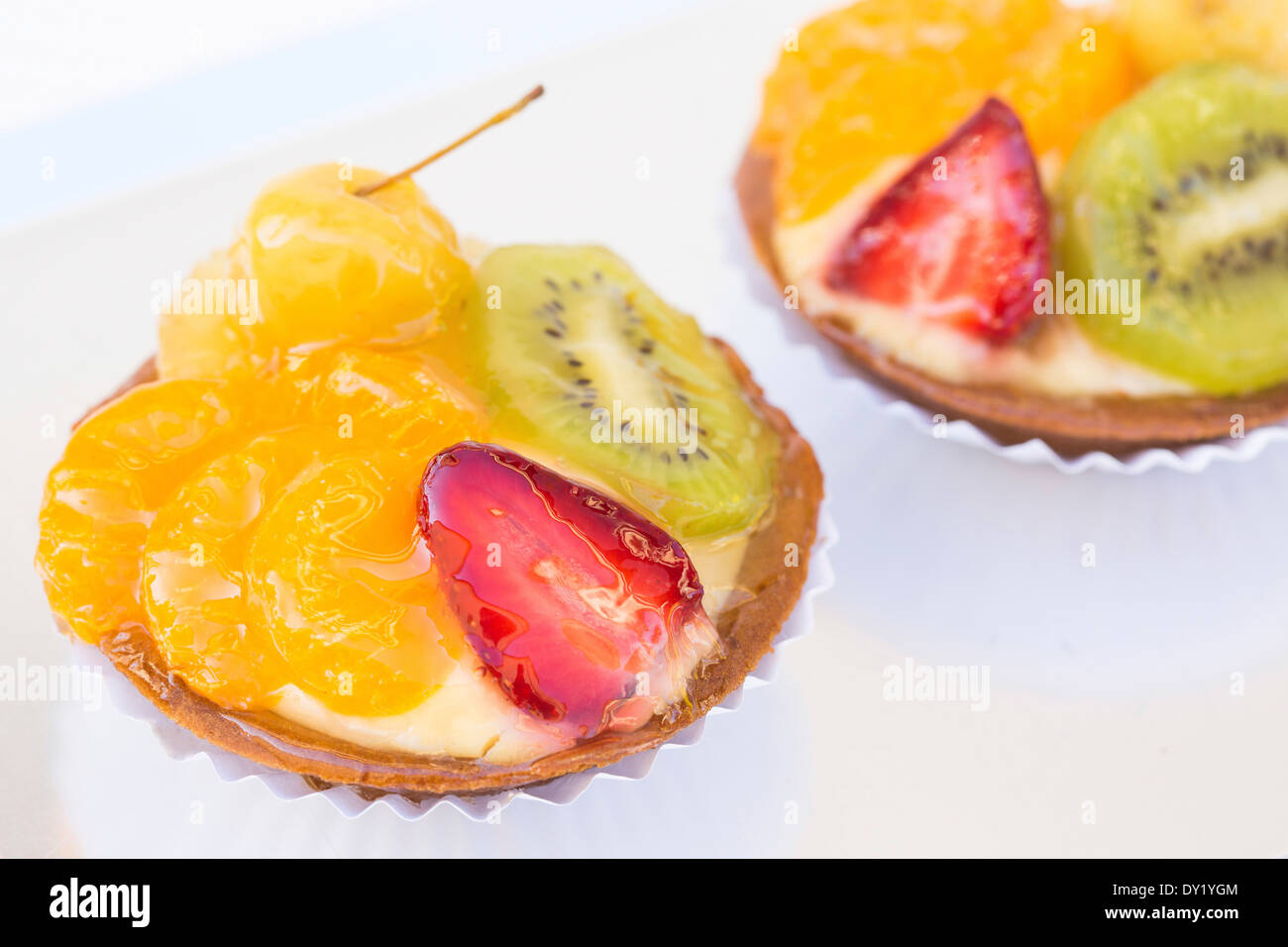 Fresh made glazed fruit and custard tarts Stock Photo