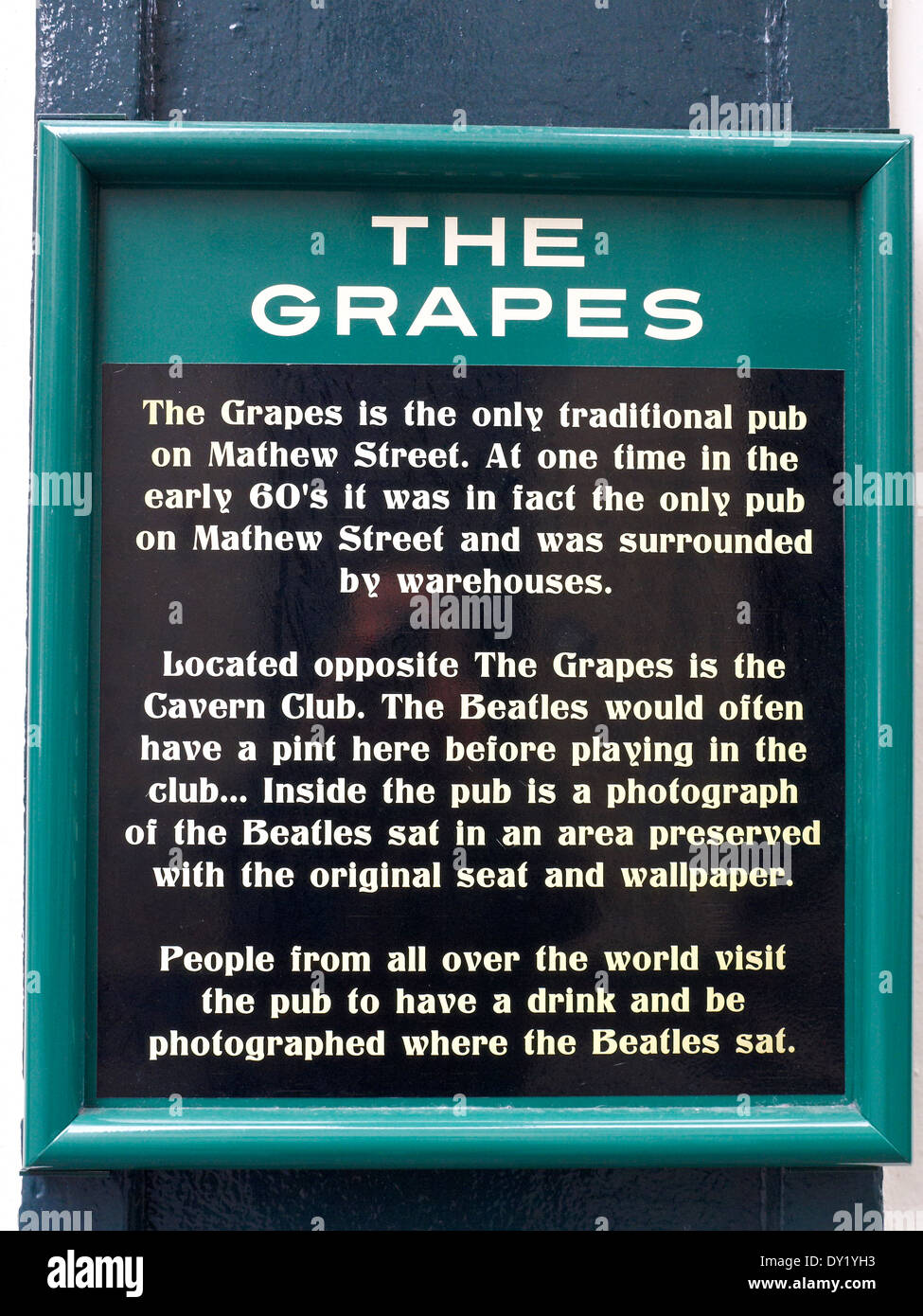 Plaque on outside wall of The Grapes pub on Mathew Street, explaining