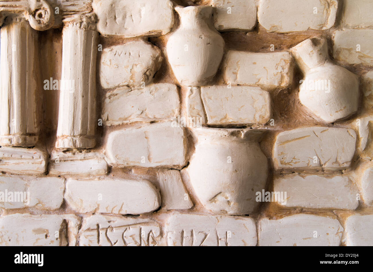 decorative plaster fragment of wall panels with jugs Stock Photo
