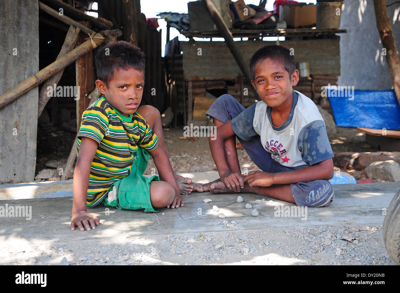 East Timor, Timor-leste, Boys Playing Game with Rocks Stock Photo