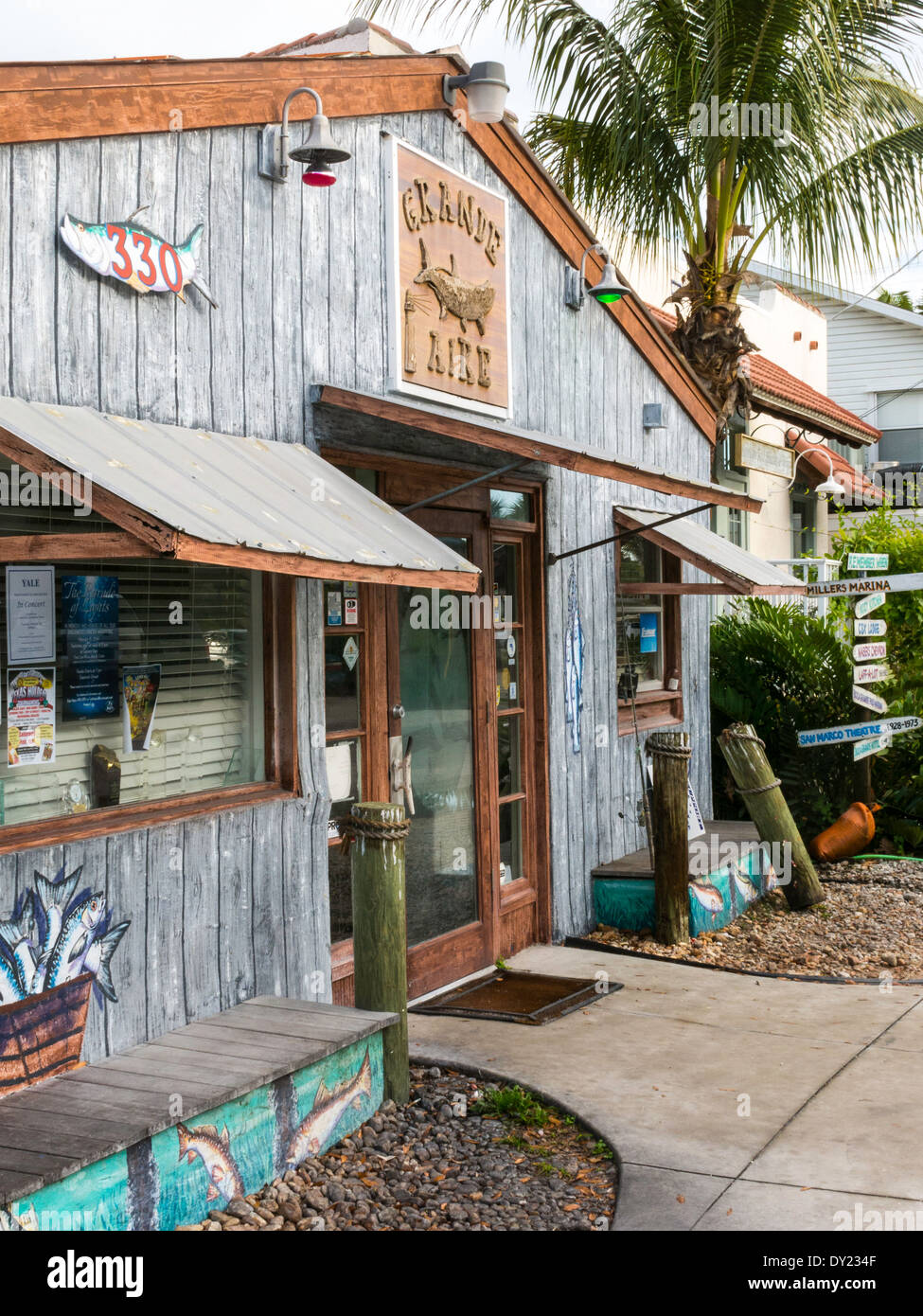 Weathered Wooden Building with Kitschy Humorous Directional Sign Post ...
