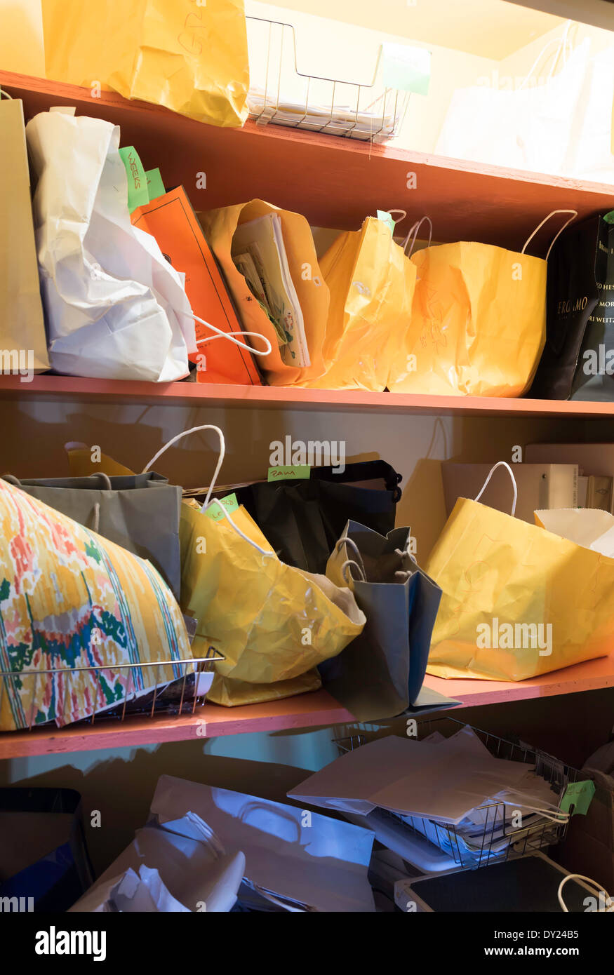 Bags Stuffed on Shelves in Hoarders' Messy Office, USA Stock Photo