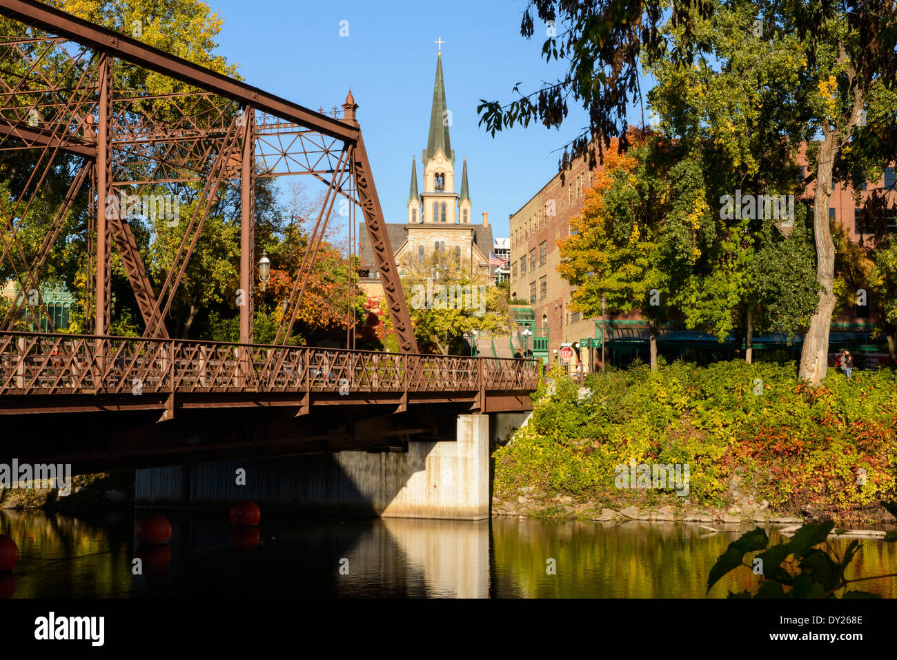 Our Lady of Lourdes Catholic Church and steel truss bridge at St Anthony Main area of Minneapolis. Stock Photo