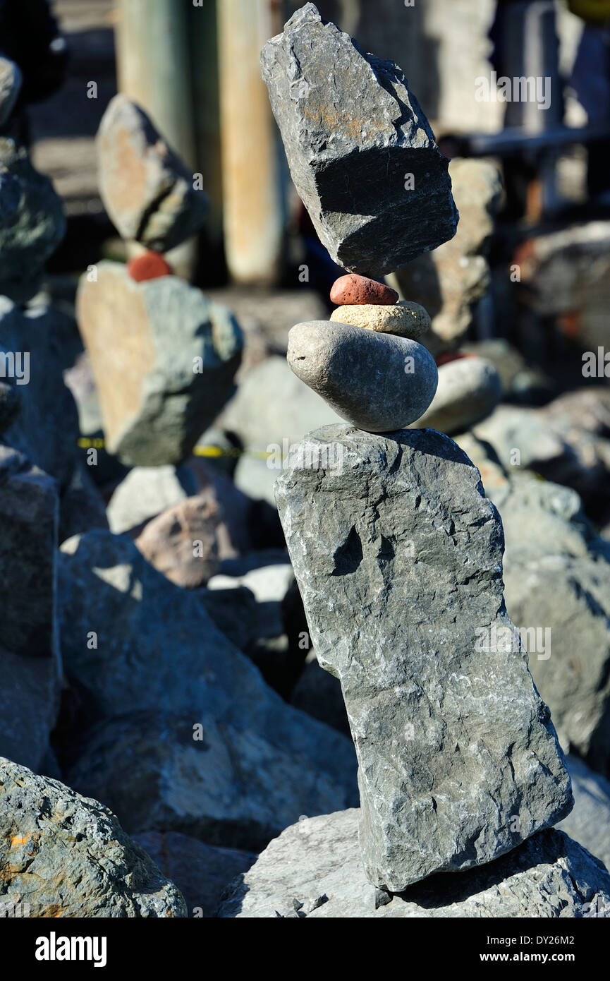 A street performer balancing rocks at the boardwalk in Sausalito California. Stock Photo