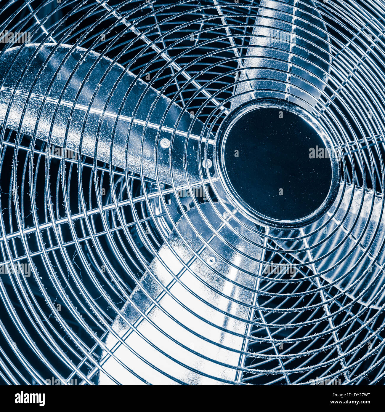 Domestic fan with four blades and dust, tinted black and white image Stock Photo