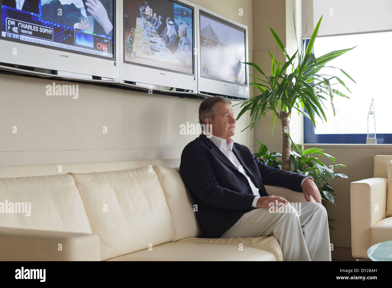 Tony Burman, Managing Director of Al Jazeera English (2008 - 2010) sits for a portrait in his office in Doha, Qatar. Stock Photo