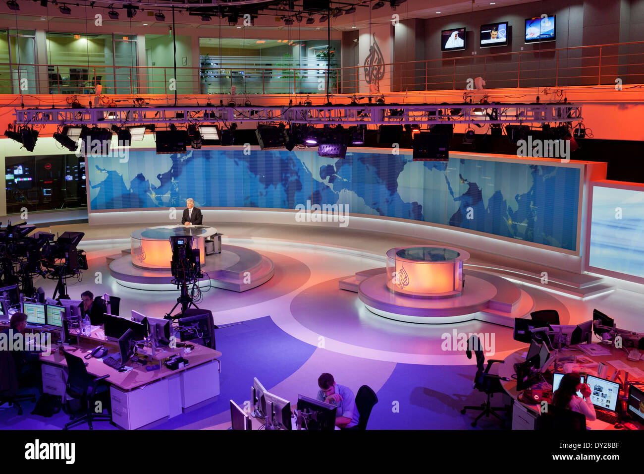 News Anchor, David Foster on camera in the main studio newsroom of Al Jazeera English in Doha, Qatar. Stock Photo