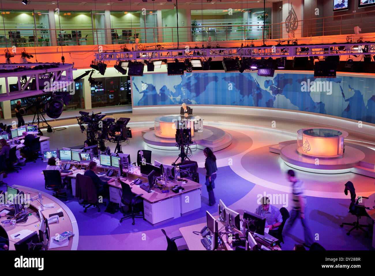 News Anchor, David Foster on camera in the main studio newsroom of AlJazeera English in Doha, Qatar. Stock Photo