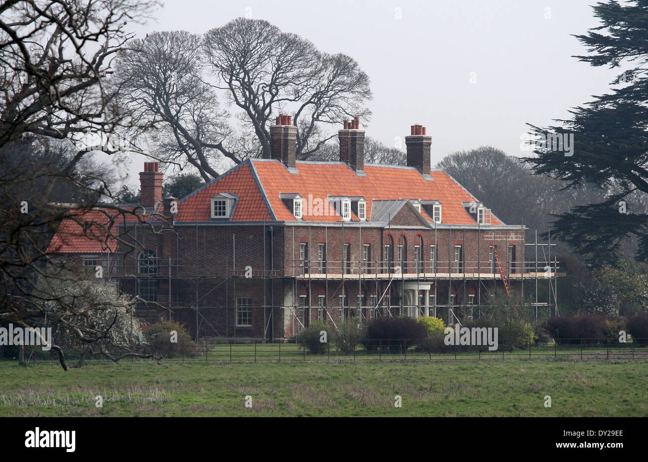 Anmer, Norfolk, UK . 03rd Apr, 2014. The roof tiles of Anmer Hall have now been replaced, and the coverings have been taken off the dormer windows as renovation and improvement works continue, before The Duke and Duchess of Cambridge move in. The new tiles have been lambasted by some people thinking the Hall now resembles a Barratt home. Anmer Hall in Norfolk, is the home given to the Duke and Duchess of Cambridge, Prince William and Kate, as a gift from her Majesty The Queen Elizabeth, to use as a country home for them to share. Credit:  Paul Marriott/Alamy Live News Stock Photo