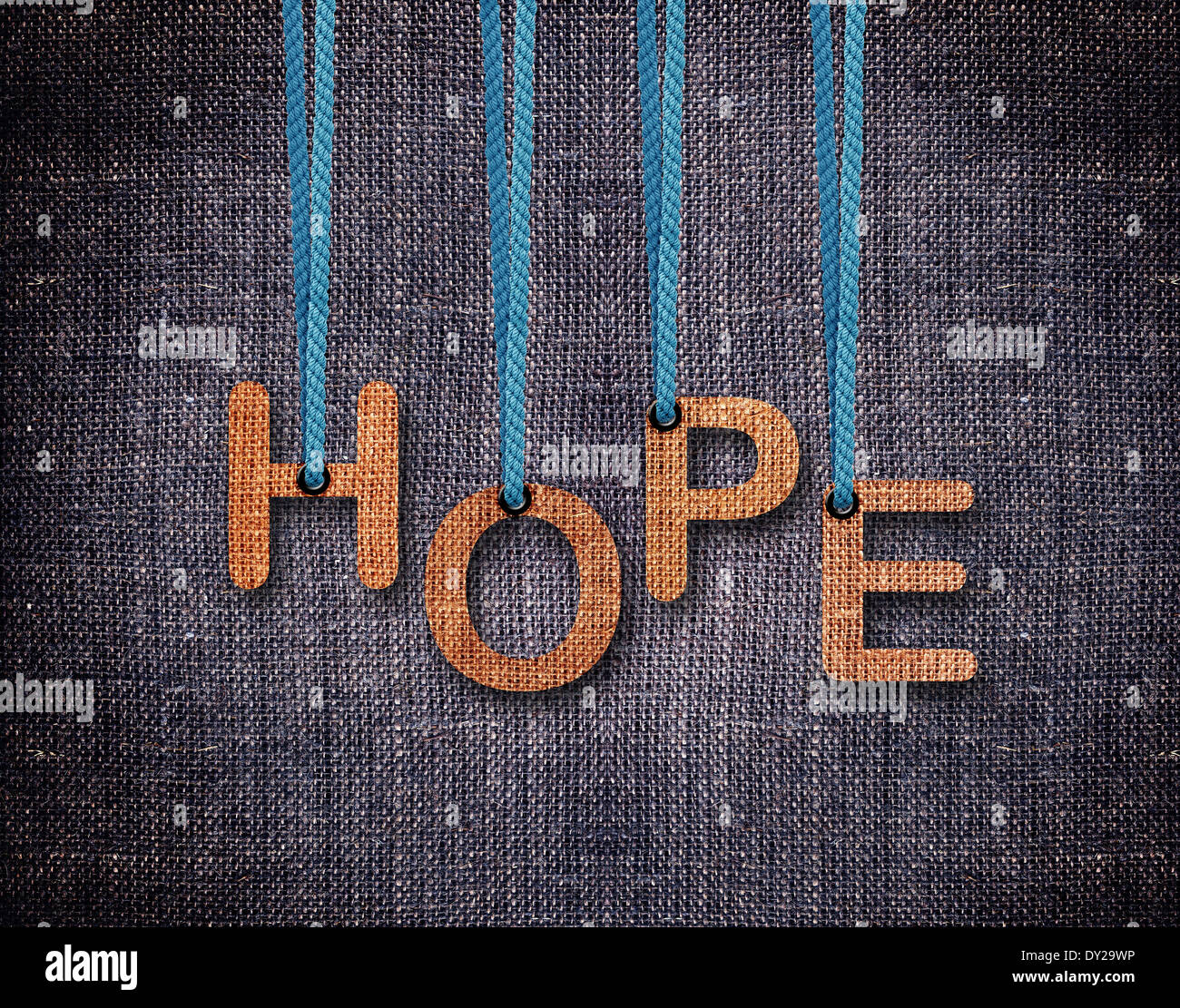 Hope Letters hanging strings with blue sackcloth background Stock Photo
